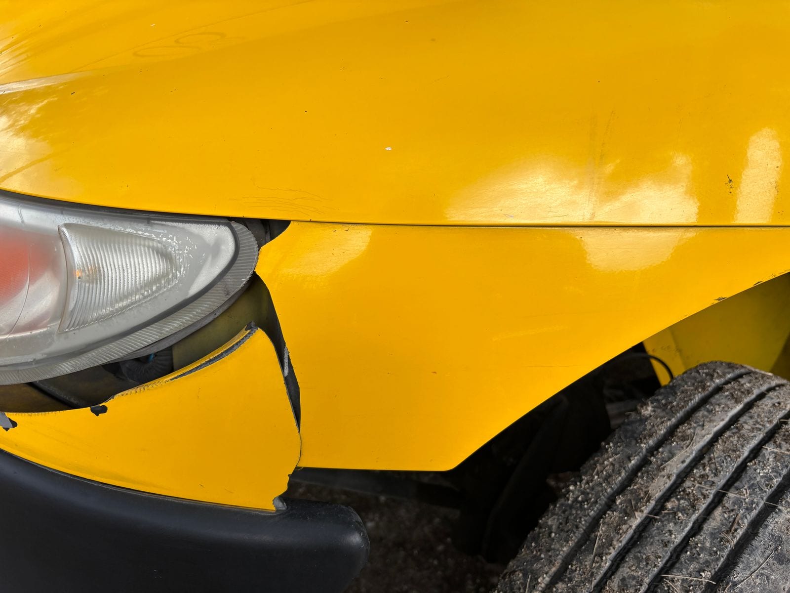 Close-up of vehicle body damage from a collision