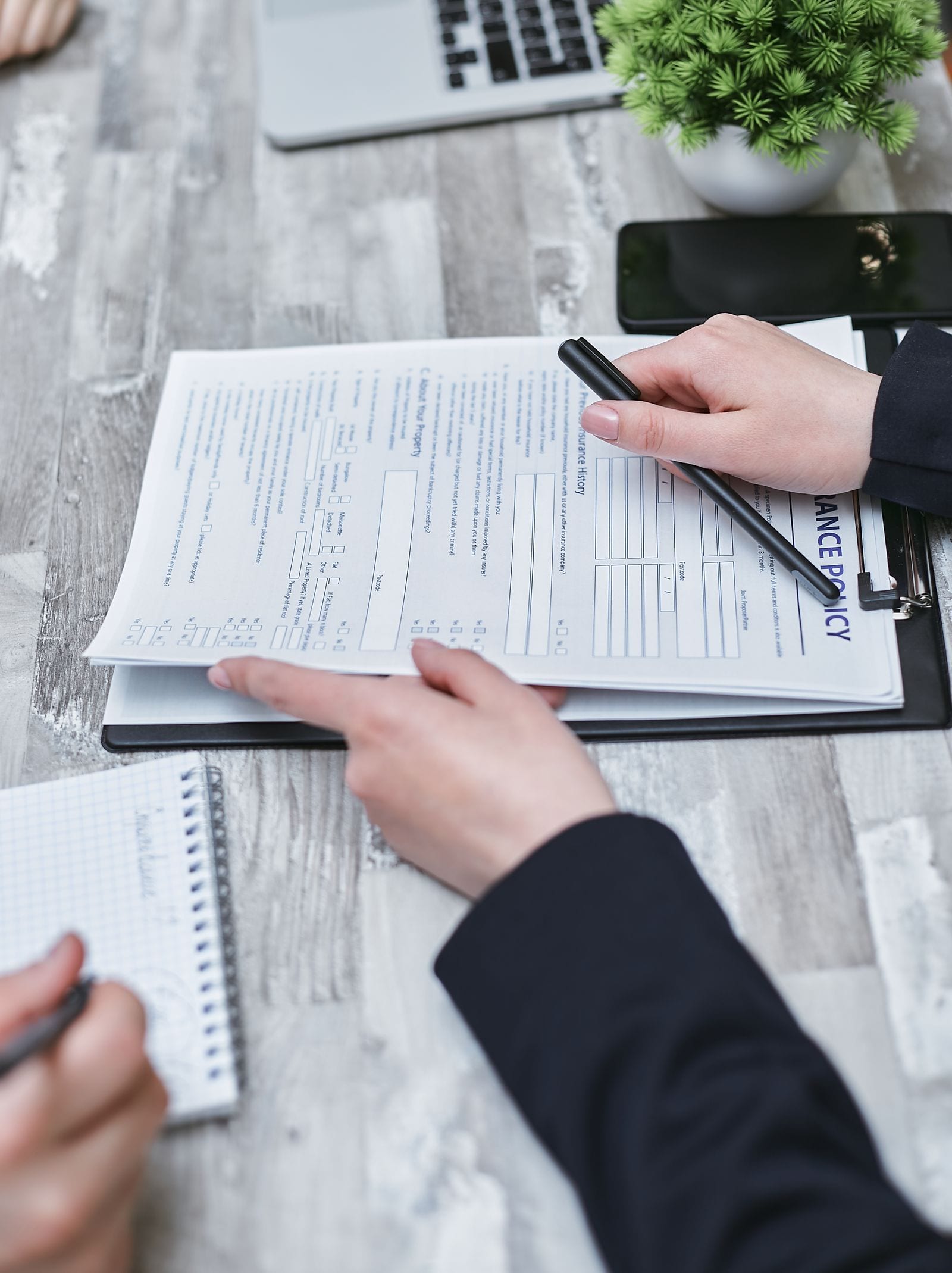 Insurance claim documents being reviewed