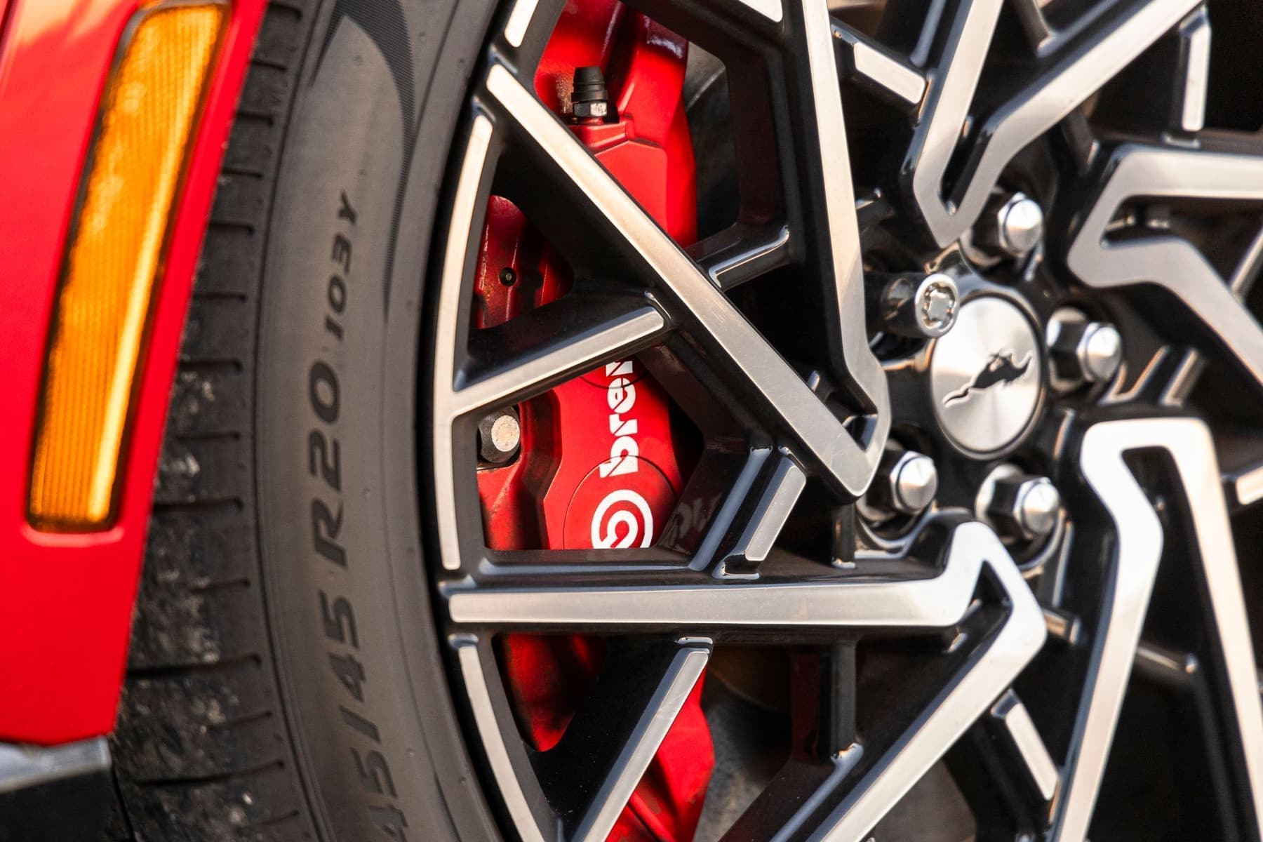 Close-up of a brake caliper and rotor during a brake inspection