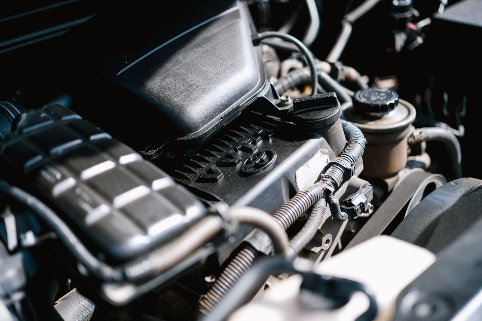 Close-up of an engine bay during a service inspection